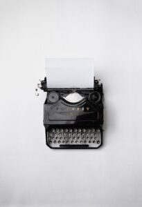 A photo of an old-fashioned black “Favorit” typewriter.